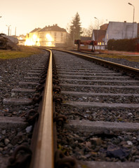 Fototapeta premium rail track with stones with a small focus at night