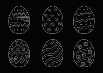 Easter eggs hand drawn white on black background. printing on fabric,gift wrap and wallpapers. 