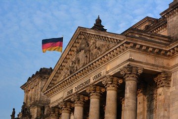 Naklejka premium Evening close-up view of the famous Reichstag Building, seat of the German Parliament (Bundestag) in beautiful golden light on October 28, 2015, Berlin Mitte district, Germany