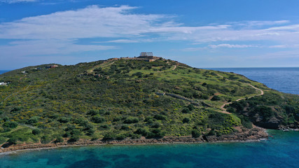 Fototapeta na wymiar Aerial drone bird's eye view of archaeological site of Cape Sounio and magnificent Ancient temple of Poseidon on top of deep blue bay, South Attica, Greece