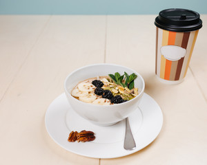 Breakfast, coffee, cereal, scrambled eggs, toast, bacon, nuts.