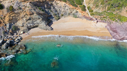 Aerial drone bird's eye view of famous emerald sea rocky beach of KAPE in area of Legrena, Sounio,...