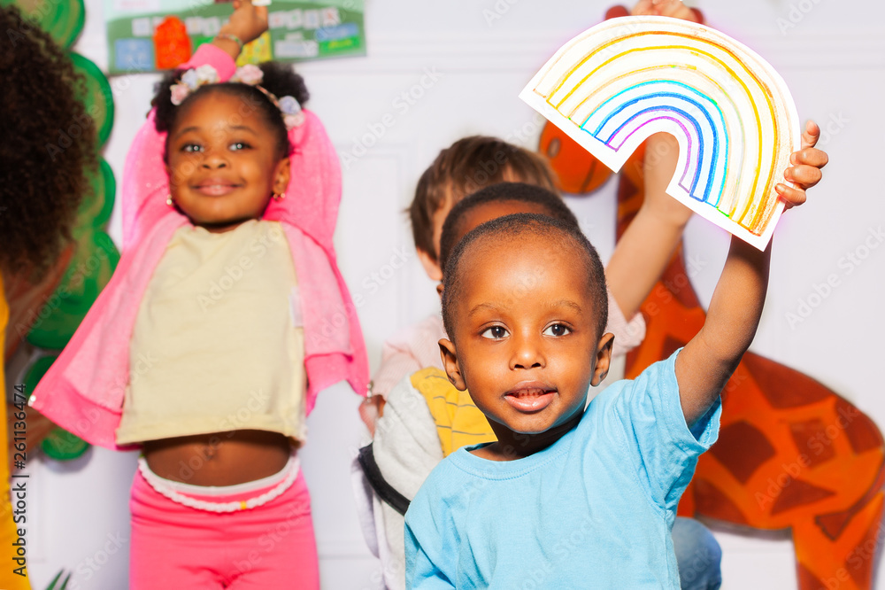 Wall mural little black boy hold rainbow card in his hand