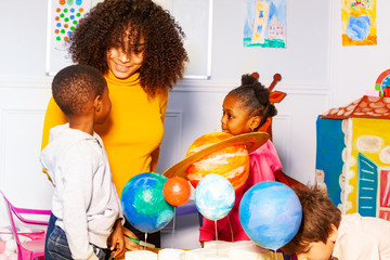 Group of kids in nursery school play learn planet
