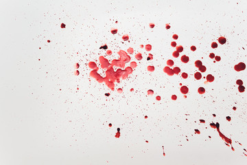 Fresh human bright red blood on floor.