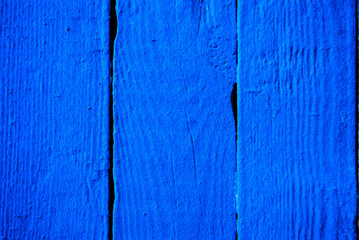 Wooden background painted with blue paint