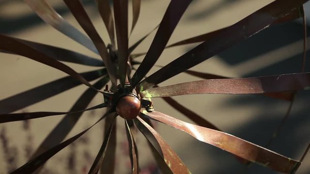 Closeup of Rustic Metal Pinwheel Spinning in the Breeze