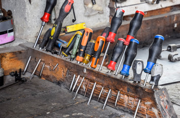 Screwdrivers and other tools in the car garage