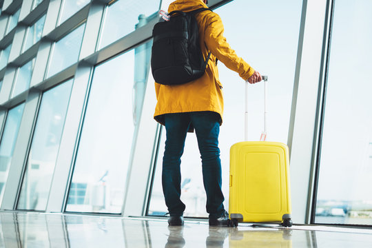 Traveler With Suitcase Backpack At Airport On Background Large Window Blue Sky, Passenger Waiting Flight In Departure Hall Of Lobby Terminal Lounge Area, Vacation Trip Concept, Empty Space Mockup