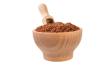 red rice in wooden bowl and scoop isolated on white background. nutrition. bio. natural food ingredient.front view.
