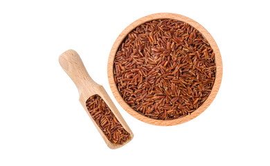 red rice in wooden bowl and scoop isolated on white background. nutrition. bio. natural food ingredient.top view.