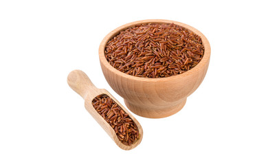 red rice in wooden bowl and scoop isolated on white background. nutrition. bio. natural food ingredient.