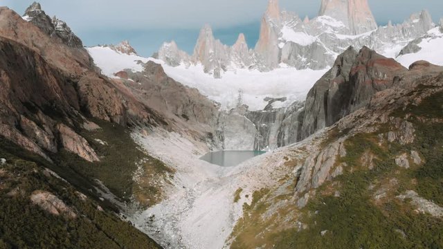 Aerial view of the peak of Mount Fitz Roy that rises above the mountain village of El Chalt&eacute;n in the Los Glaciares National Park. 4k