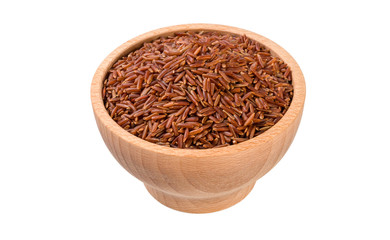 red rice in wooden bowl isolated on white background. nutrition. food ingredient.