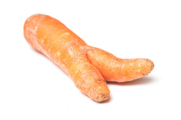 closeup of deformed carrot on white background