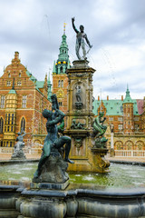 Frederiksborg castle or palace: Neptune Fountain on the castle's forecourt. Hillerod, Denmark. © JethroT