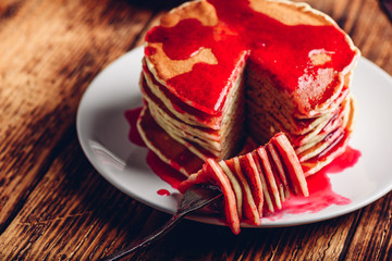 Stack of pancakes with berry fruit marmalade