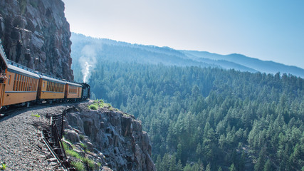 The Durango-Silverton train, Colorado (USA), moving slowy across rocks and cliffs