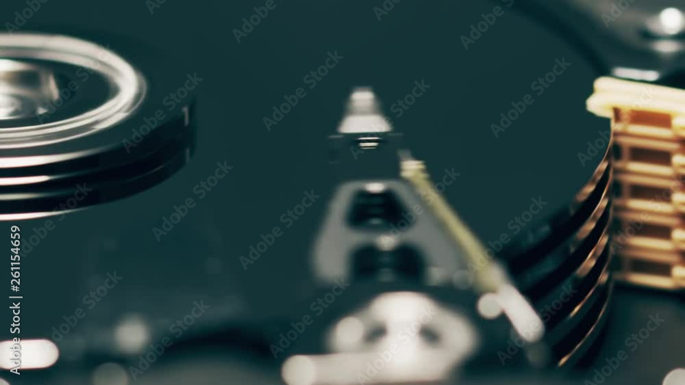 Poster moving heads of computer hdd or hard disk drive, slow motion macro shot