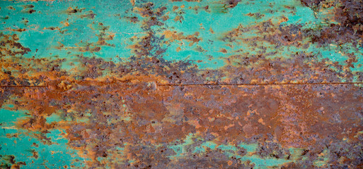 Rusty metal textured background. Old rough rusted grungy surface with chipped blue paint.