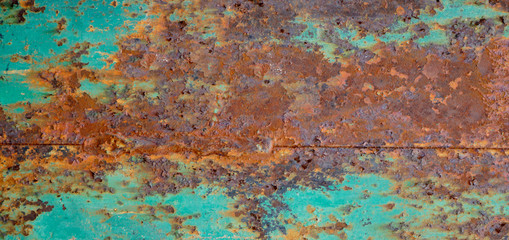 Rusty metal textured background. Old rough rusted grungy surface with chipped blue paint.