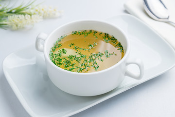 Chicken soup bouillon in a plate