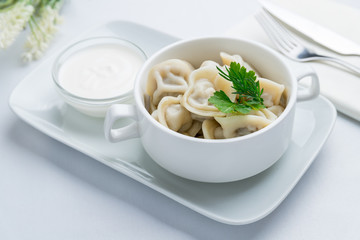 Dumplings with sour cream and herbs
