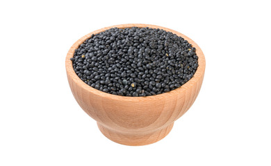 black lentils beluga in wooden bowl isolated on white background. nutrition. food ingredient.