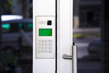 Secure password on keyboard for opening home house door. Password code Security keypad system protected in Public Building. The security code combination to unlock the door