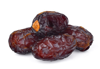 pile of dried medjool date fruit isolated on white background