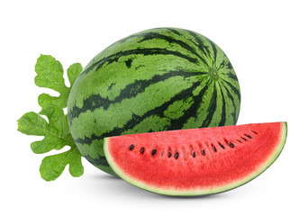 whole and slices watermelon with green leaves isolated on white background