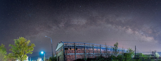 milky way above abandoned building