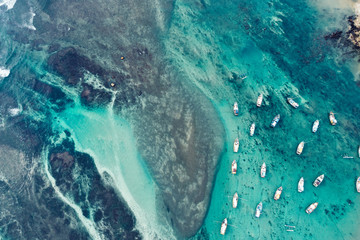 Fototapeta na wymiar Aerial view of beautiful seascape with fishing boats in the coast