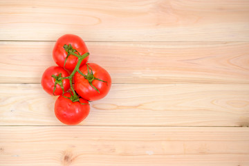 fresh tomato slice on wood background