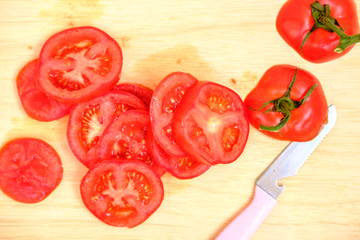 fresh tomato slice on wood background