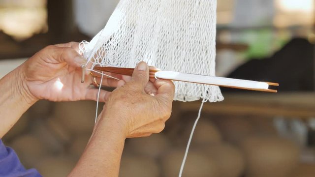 Weave a fishing trap net. 
