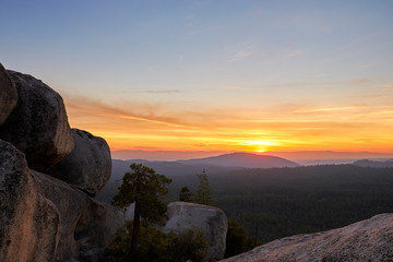 Fototapeta na wymiar Sunset over mountains on Bald Rock, California