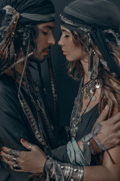 stylish fashionable young handsome man and woman. gypsy fashion concept
