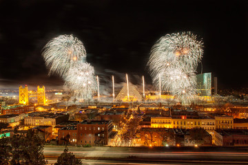 New Years Eve Fireworks in Sacramento, California over the river with a highway in the foreground.