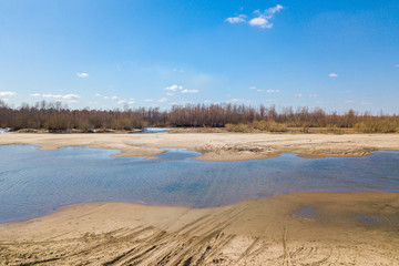 Aerial view: landscape of river, beach and forest, top view of beautiful nature texture from drone