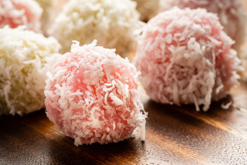 Colorful coconut ball,Thai traditional dessert, Ka Nom Tom on wood plate