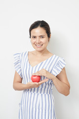 Woman holding red heart shaped