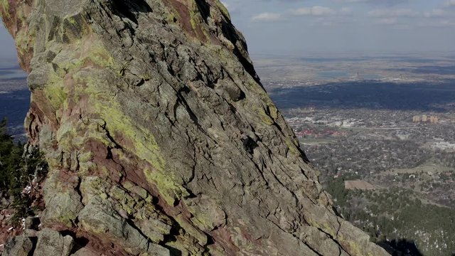 Aerial footage of Flatiron rocks with climber west of Boulder Colorado