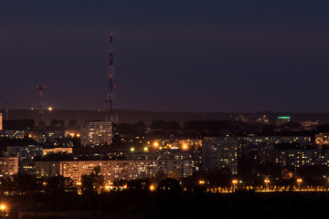 Fototapeta premium lights of the night city with a television tower