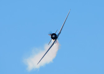 Frontal view of a A6M "Zero", with smoke from the plane