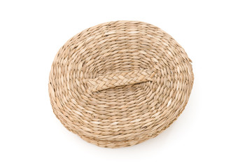 Small wicker basket with top from top view on a white background
