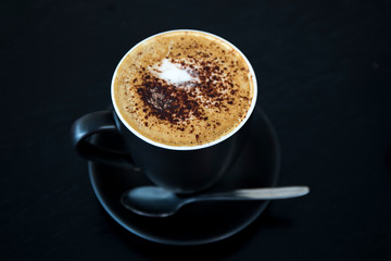 Cappuccino in the black cup