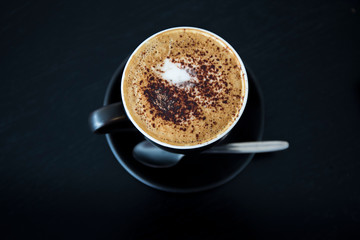 Cappuccino in the black cup