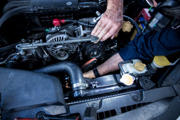 Close Up Photo Of Mechanic Repairing Car