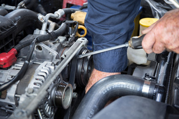 Fototapeta na wymiar Close Up Photo Of Mechanic Repairing Car
